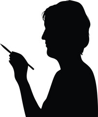 Senior individual silhouette in profile carefully holding a stylus or pen for writing or digital creation