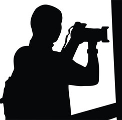 Silhouette of a photographer with camera capturing an important moment from an event or scene