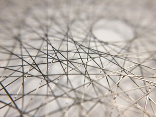 Abstract macro shot of tangled thin silver metal wires