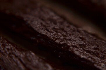 Close-up of brown rubber tire repair plugs for tubeless tire puncture recovery