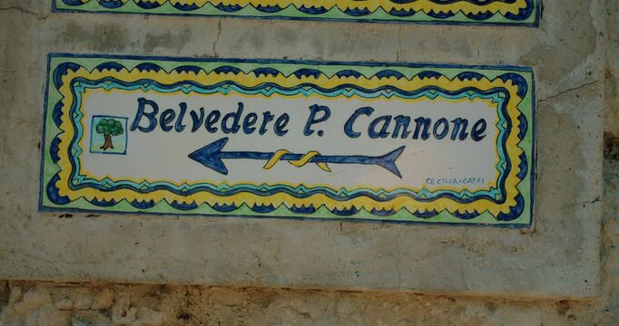 Hand painted Belvedere di Punta Cannone direction sign on stone wall in Capri Italy