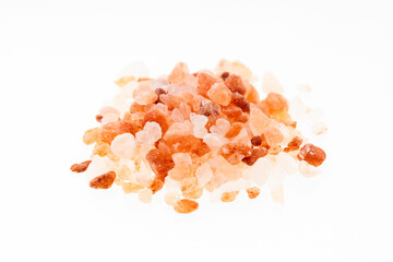 Pile of pink Himalayan salts on a white background
