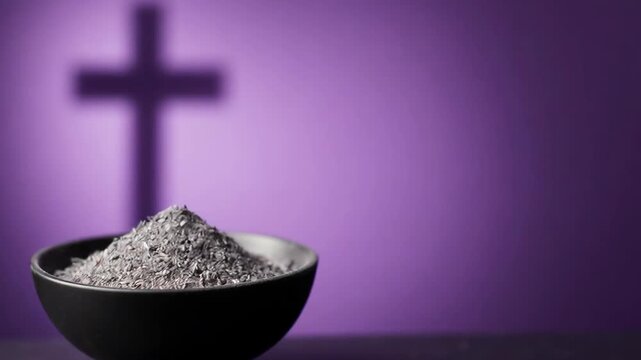 Bowl of ash with a cross shadow on purple background, symbolizing ash wednesday and the beginning of lent season. Christian religion concept.
