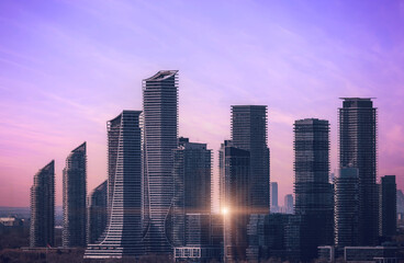 Obraz premium Scenic Etobicoke skyline of newly built condos and businesses near Gardiner Highway and downtown Toronto Ontario lake.