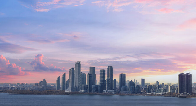 Scenic Etobicoke skyline of newly built condos and businesses near Gardiner Highway and downtown Toronto Ontario lake.