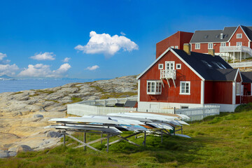 Typical architecture of Greenland Ilulissat with colored houses located near fjords and icebergs. © eskystudio