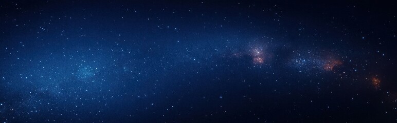 Fototapeta premium Vast starry night sky with countless stars and distant galaxy clusters glowing softly against deep blue space