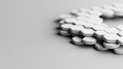 Stacked white hexagonal tokens on gray surface