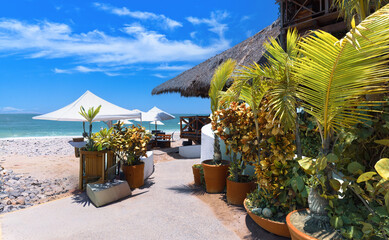 Restaurants and cafes with ocean views on Playa De Los Muertos beach and pier near famous Puerto Vallarta Malecon, the city largest public beach .