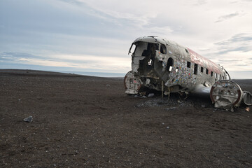 View of Wreckage of DC plane on black sand beach in Iceland a popular tourist