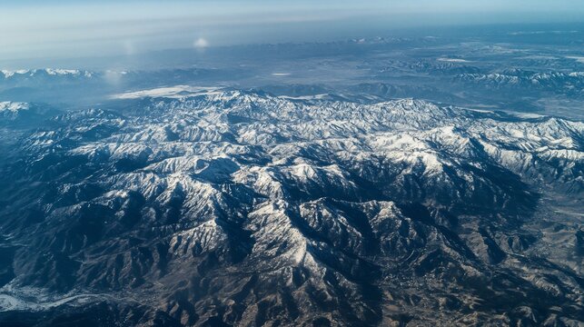 aerial view of mountains in the snow - Powered by Adobe