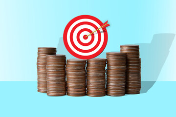 target bullseye coin stacks investment goal financial success strategy concept
