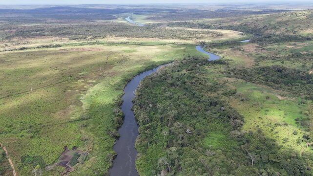 A wide-angle aerial perspective of the vast Calandula Falls landscape, highlighting the river winding through the dense Angolan forest africa drone landscape view
