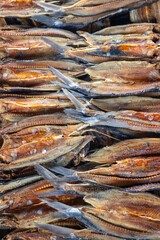 Dried salted fish stacked in rows showing preserved seafood texture and traditional curing process