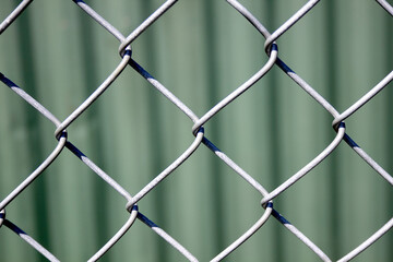 Chain Link Fence and Green Background