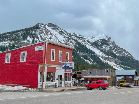 Cooke City, Montana, USA - May 18, 2022.  Snow covered mountains surround the picturesque town of Cooke City 