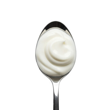 Macro top-down view of a swirl of greek yogurt on a polished steel tablespoon against a transparent background. Healthy food advertising concept