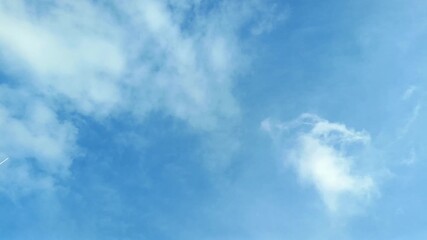 Blue sky with soft white clouds is shown creating wide open space for background use. Nature sky background concept - Powered by Adobe