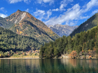 Beautiful scenery of Mirror Lake at Jiuzaigou national park, Sichuan China in autumn season. Famous travelling destination 