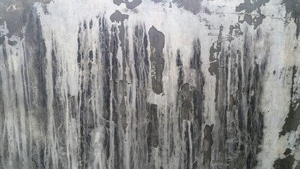 textured wall surface with water stains and abstract patterns