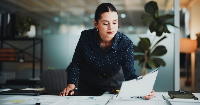 Finance, review and woman in office with paper, funding ideas or data analysis for budget pitch. Reading, graphs and analyst in agency with documents, financial report or proposal for investment plan