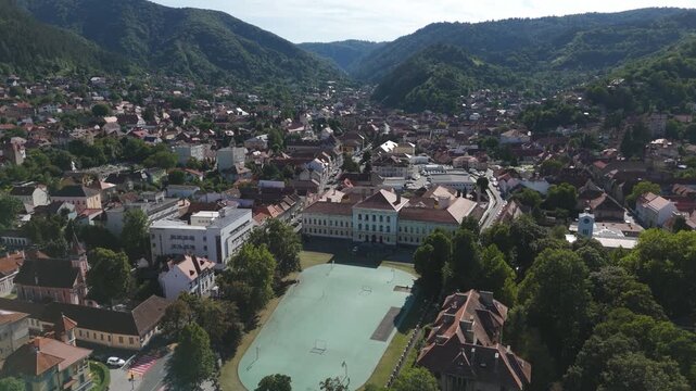 Aerial circling Andrei Șaguna National College in Brasov, Romania, highlighting its architecture.