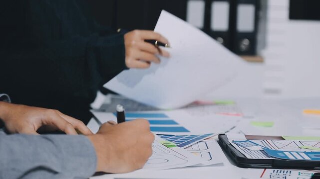 UXUI Design Collaboration. Professionals discussing digital project at modern workspace.