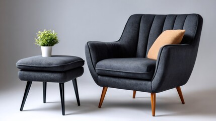 Dark gray armchair and ottoman set on white background