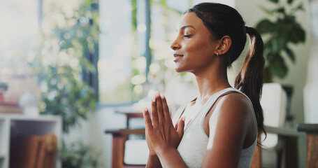 Meditation, smile and prayer hands with woman in home for spiritual balance, holistic and...