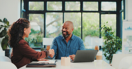 Handshake, deal and people in office with laptop, collaboration or meeting for b2b proposal. Shaking hands, approval or employees in agency with tech, negotiation or shared opportunity for success.