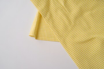 Yellow Checkered Fabric Texture Background with Soft Folds for Fashion Textile and Design Use