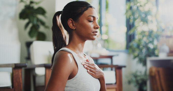 Meditation, peace and breathing with woman in home for spiritual balance, holistic and mindfulness. Wellness, chakra and yoga with person in living room of apartment for fitness, zen and health