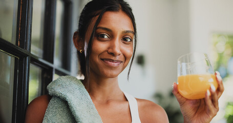 Portrait, woman and juice for fitness, home and confident for wellness, healthy and organic beverage. Happy, Indian person and drink with vitamin c for energy boost, nutrition or liquid for hydration © peopleimages.com