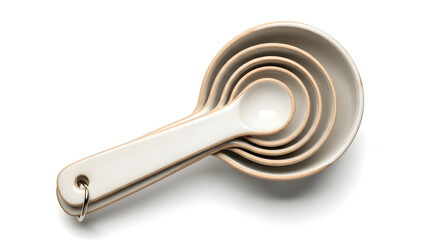 A clean and elegant set of nested white ceramic measuring spoons, essential tools for precise baking and cooking, isolated on a white background