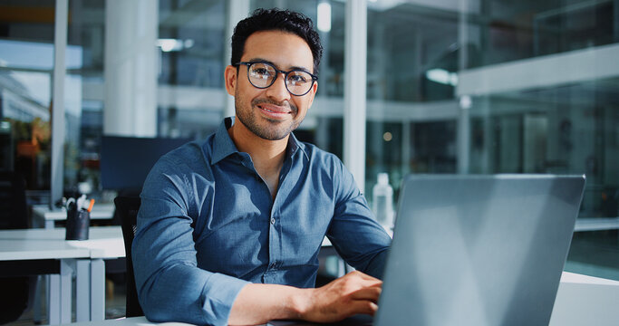 Businessman, portrait and smile in office with laptop, pride and bookkeeping as accountant. Male person, glasses and tech for finance agency, banking and investment opportunity for payroll in job
