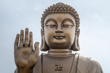 Close up detail on The Nanshan great Buddha. The world's largest bronze Buddha. It is 38m high