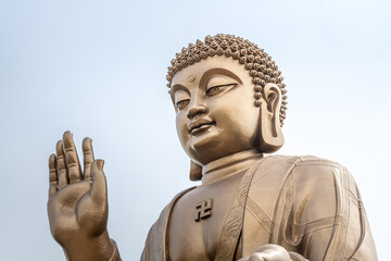 Close up of Great Buddha Statue in the Nanshan scenic area of the Jiaodong Peninsula on a sunny summer day, Longkou, Shandong, China