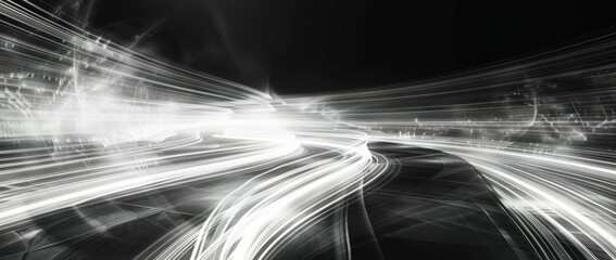 Dynamic light trails create a mesmerizing abstract scene in black and white during nighttime
