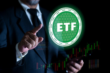 Businessman pointing at ETF (Exchange Traded Funds). Investment Opportunities in Mutual Funds and ETFs, Growing Wealth in the Financial Market.