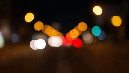 Abstract blurred city lights with colorful bokeh circles at night