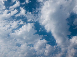 fluffy white clouds in a blue sky