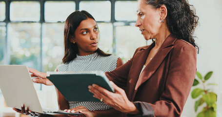 Creative women, discussion and tech for designer agency in office for internship or project management. App, meeting and teamwork with woman, mentor and coaching for training conversation or update