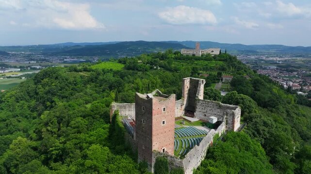 aerial closeup of the castles that inspired the Romeo and Juliet story, Montecchio Maggiore, the Castello di Giulietta perched on top of a hill overlooking the countryside, Italy