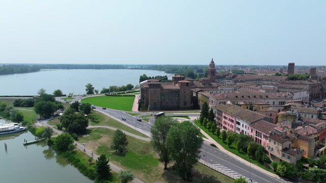 Italian town of Montova, aerial pan from Castello di San Giorgio to the Lago Superiore ferry boats and beyond in this tourism enclave in the Lombardy region of Italy
