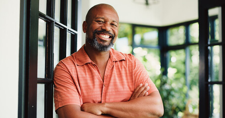 Smile, arms crossed and portrait of black man in home for peace, confidence and retirement. Happiness, pride and weekend break with mature person in living room of apartment for calm, chill and rest