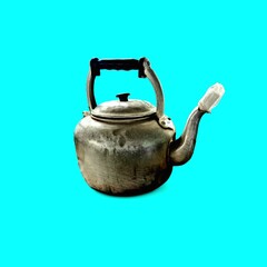 Vintage Aluminum Tea Kettle on Vibrant Cyan Background