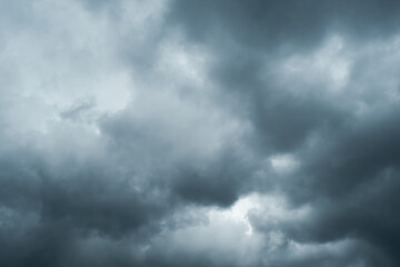Dark storm clouds gathering in the sky, creating a dramatic and moody atmosphere that symbolizes approaching rain, weather change, and natural power