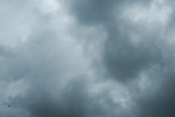 Dark storm clouds gathering in the sky, creating a dramatic and moody atmosphere that symbolizes approaching rain, weather change, and natural power