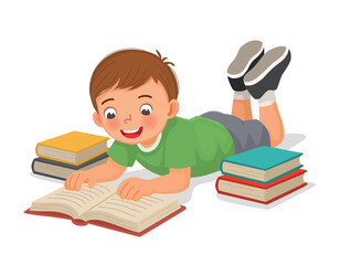 Little boy reading book lying on the floor