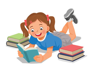 Little girl reading book lying on the floor